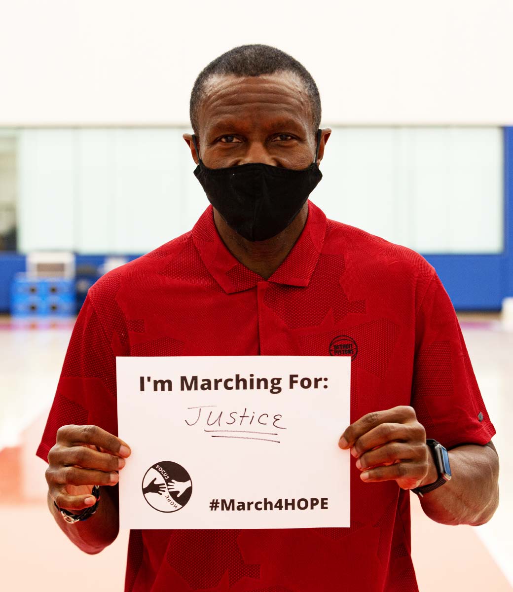 Community & 91Pro - Man with Marching for Justice Sign